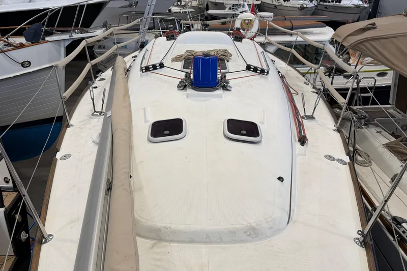 Slide: The Image of 2006 Beneteau First 36.7 sailboat deck view, docked among other boats. - 20