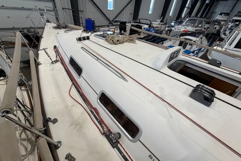 Slide: The Image of 2006 Beneteau First 36.7 sailboat deck in a storage facility. - 22