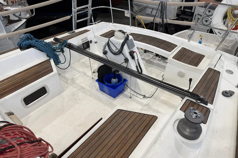Slide: The Image of 2006 Beneteau First 36.7 sailboat cockpit with ropes and winches, showcasing teak seating. - 25