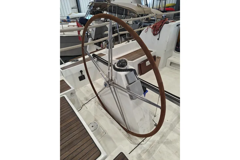 Slide: The Image of Steering wheel of a 2006 Beneteau First 36.7 sailboat in a marina. - 26
