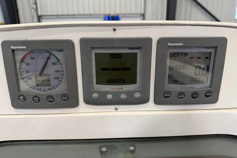 Slide: The Image of Raymarine navigation instruments on a 2006 Beneteau First 36.7 yacht dashboard. - 28