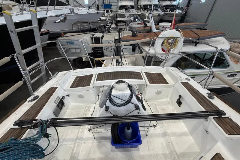 Slide: The Image of 2006 Beneteau First 36.7 sailboat cockpit with wooden accents in a marina setting. - 29