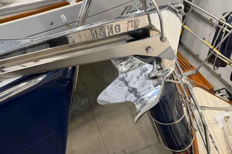 Slide: The Image of Shiny anchor on 2006 Beneteau First 36.7 sailboat, marked 15KG, in a marina setting. - 32