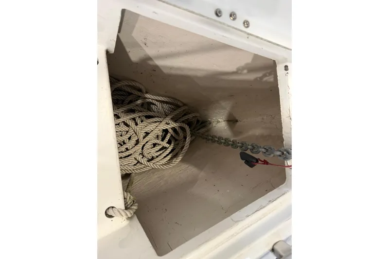 Slide: The Image of Anchor locker with rope and chain on 2006 Beneteau First 36.7 sailboat. - 33
