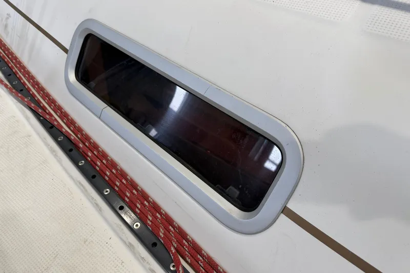 Slide: The Image of Close-up of a 2006 Beneteau First 36.7 yacht window and deck details. - 38