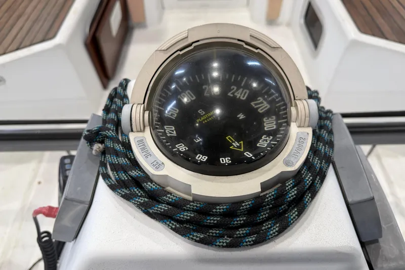 Slide: The Image of Compass on 2006 Beneteau First 36.7 yacht, surrounded by coiled rope. - 40