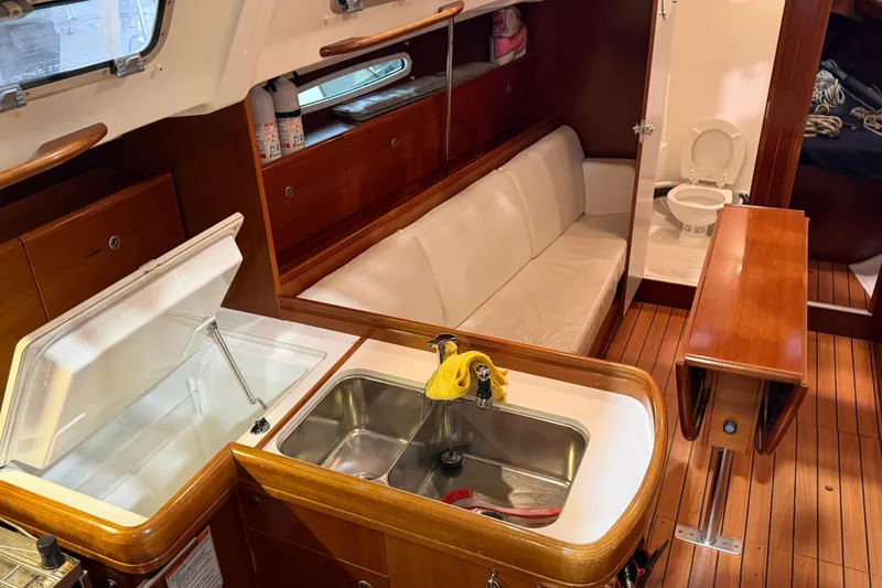 Slide: The Image of Interior of 2006 Beneteau First 36.7 yacht with kitchen, seating, and bathroom. - 44