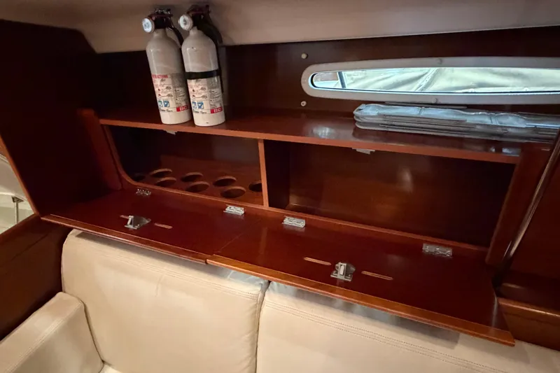 Slide: The Image of Interior of 2006 Beneteau First 36.7 yacht with wooden storage and fire extinguishers. - 47