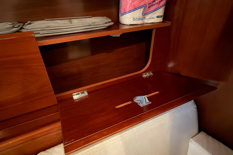 Slide: The Image of Wooden storage compartment in a 2006 Beneteau First 36.7 yacht interior. - 54