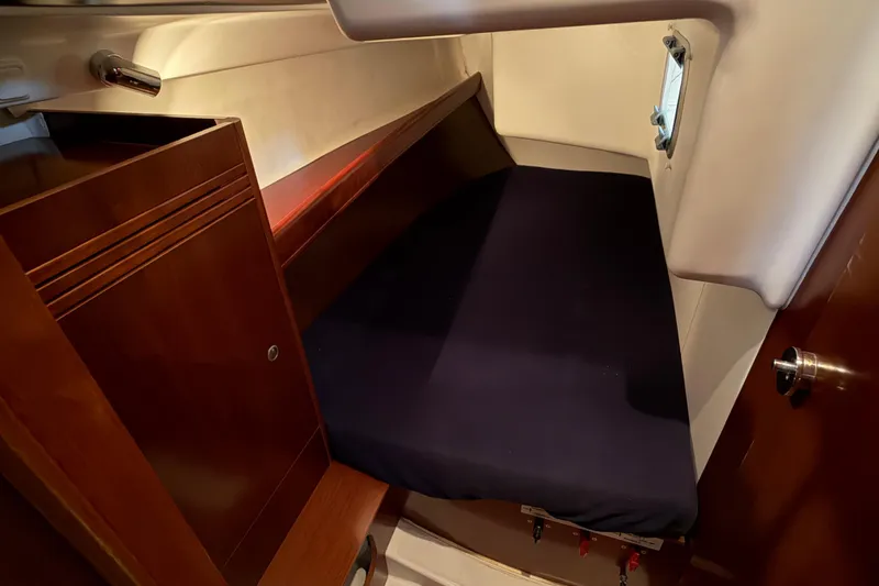 Slide: The Image of Cozy cabin interior of 2006 Beneteau First 36.7 sailboat with wooden cabinetry. - 57