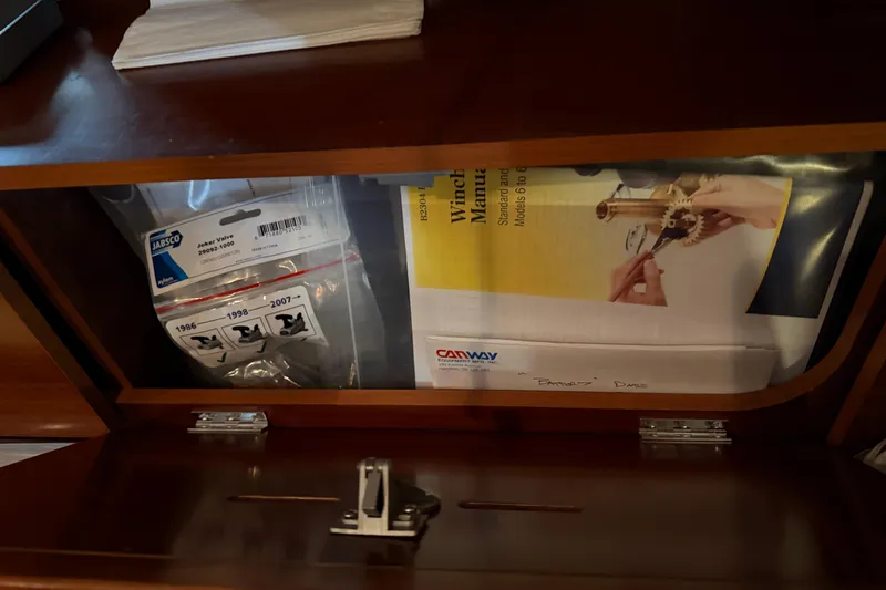 Slide: The Image of Cabinet with boat manuals and parts for 2006 Beneteau First 36.7 yacht. - 64