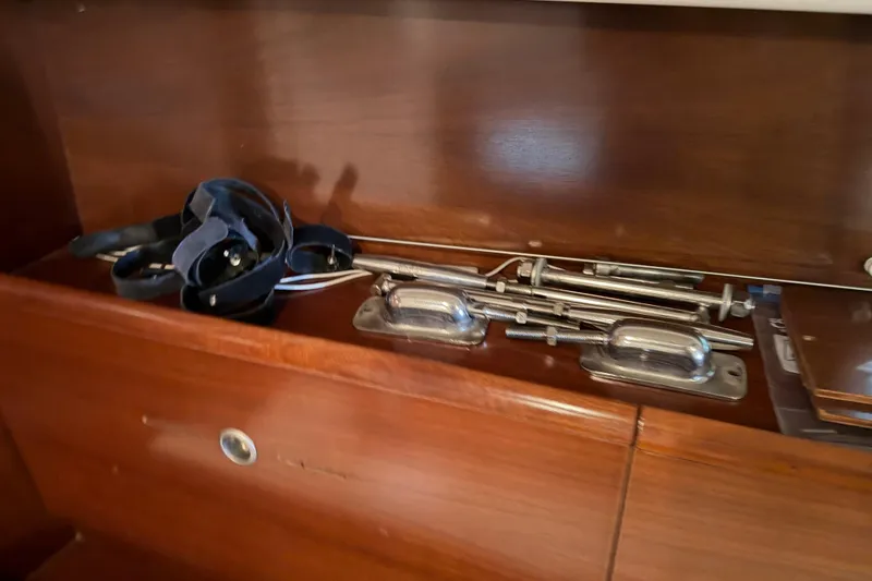 Slide: The Image of Interior of 2006 Beneteau First 36.7 with sailing equipment on wooden shelf. - 66