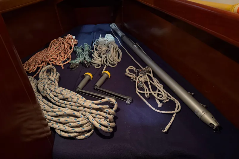 Slide: The Image of Sailing equipment on Beneteau First 36.7, 2006 model, including ropes and winch handles. - 70