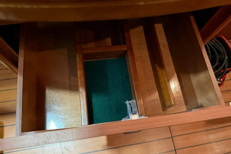 Slide: The Image of Wooden storage compartments inside a 2006 Beneteau First 36.7 sailboat. - 80