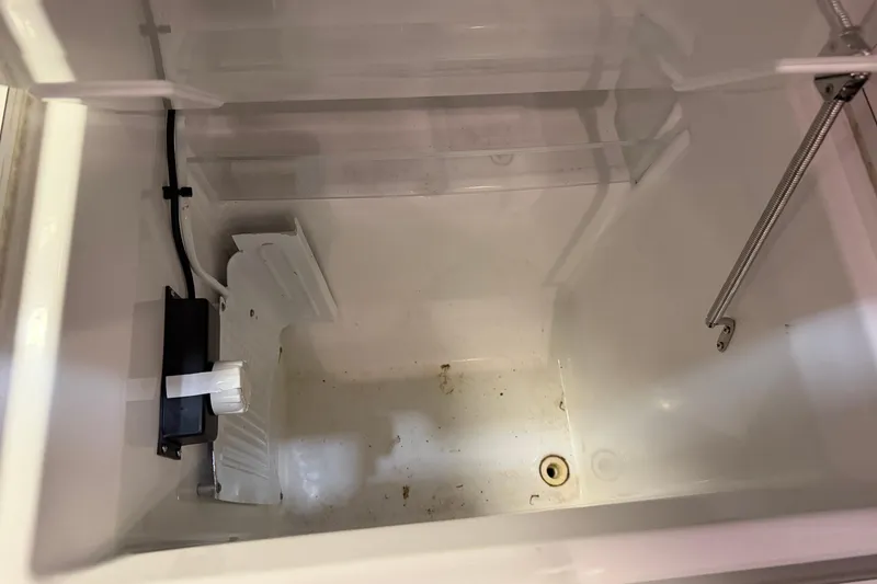 Slide: The Image of Empty storage compartment in a 2006 Beneteau First 36.7 sailboat. - 82