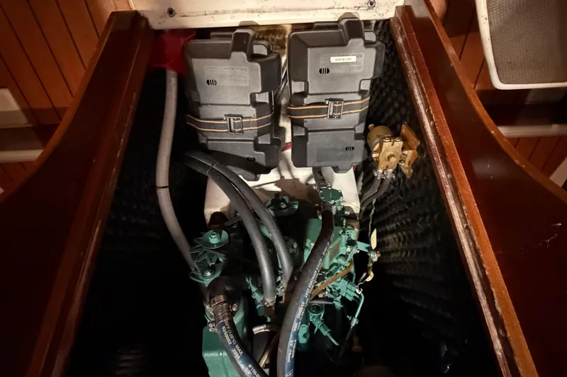 Slide: The Image of Engine compartment of 2006 Beneteau First 36.7 sailboat, showcasing mechanical components. - 86