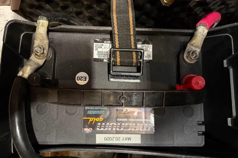 Slide: The Image of Marine battery in a 2006 Beneteau First 36.7 sailboat, secured with straps. - 90