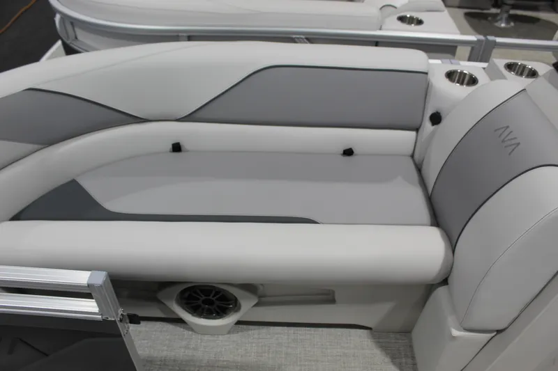 Slide: The Image of Luxurious seating on 2026 Avalon 2185 25 Venture 85 VRB pontoon boat, featuring cup holders and speaker. - 4