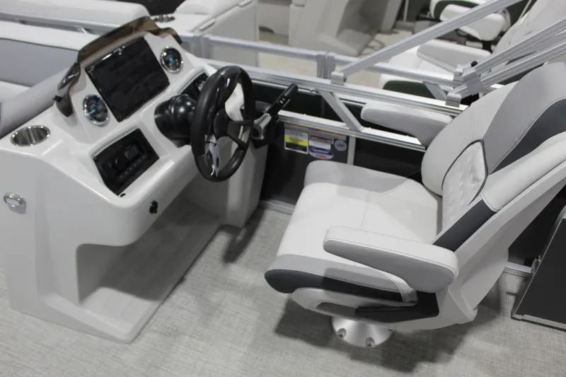 Slide: The Image of 2026 Avalon 2185 25 VENTURE 85 VRB boat cockpit with steering wheel and captain's chair. - 5
