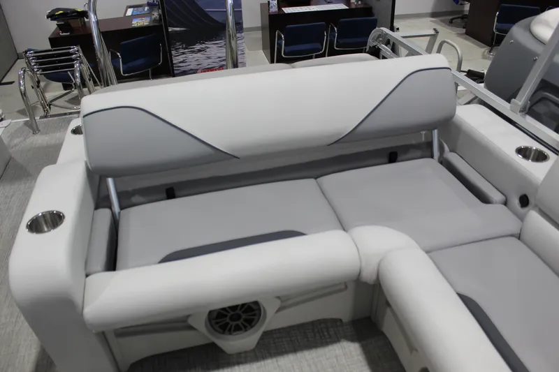 Slide: The Image of Luxurious seating on 2026 Avalon 2185 25 VENTURE 85 VRB boat, featuring cup holders and speaker. - 7