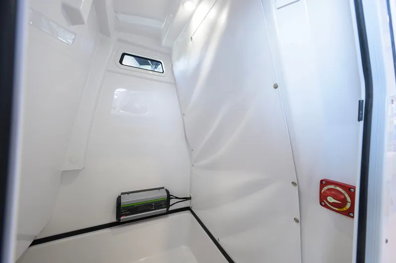 Slide: The Image of Interior cabin of 2026 Sportsman Masters 247OE Bay Boat, featuring sleek white design. - 44