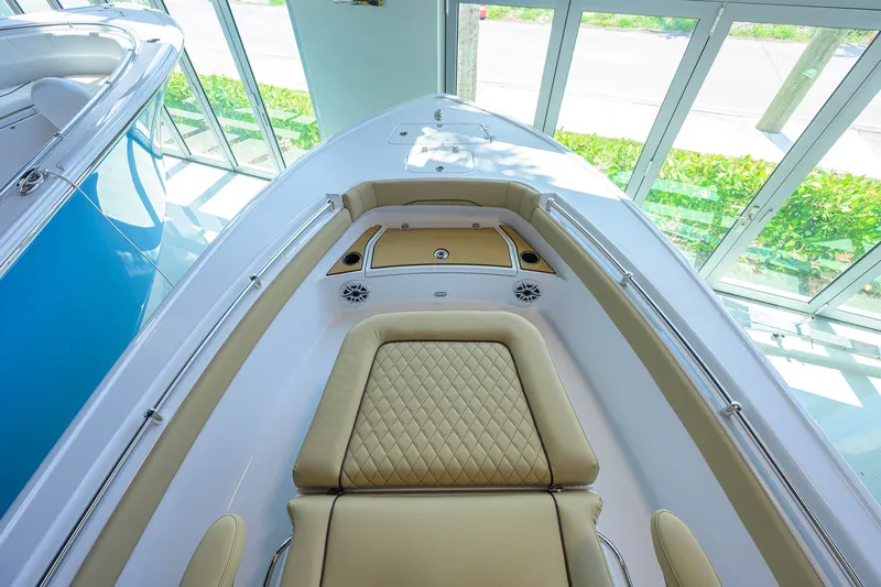 Slide: The Image of 2026 Sportsman Masters 247OE Bay Boat interior with tan seating and sleek design. - 10