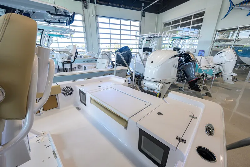 Slide: The Image of 2026 Sportsman Masters 247OE Bay Boat interior with modern seating and powerful outboard engines. - 26