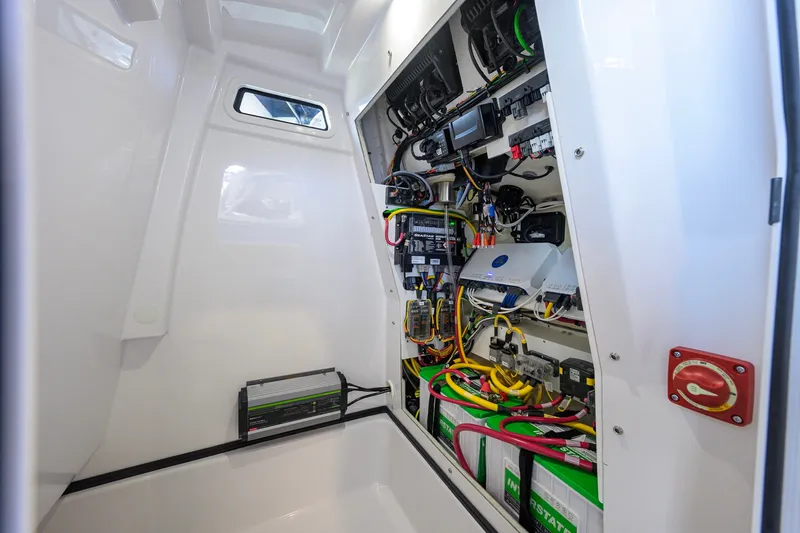 Slide: The Image of Electrical system inside 2026 Sportsman Masters 247OE Bay Boat, showcasing wiring and components. - 45