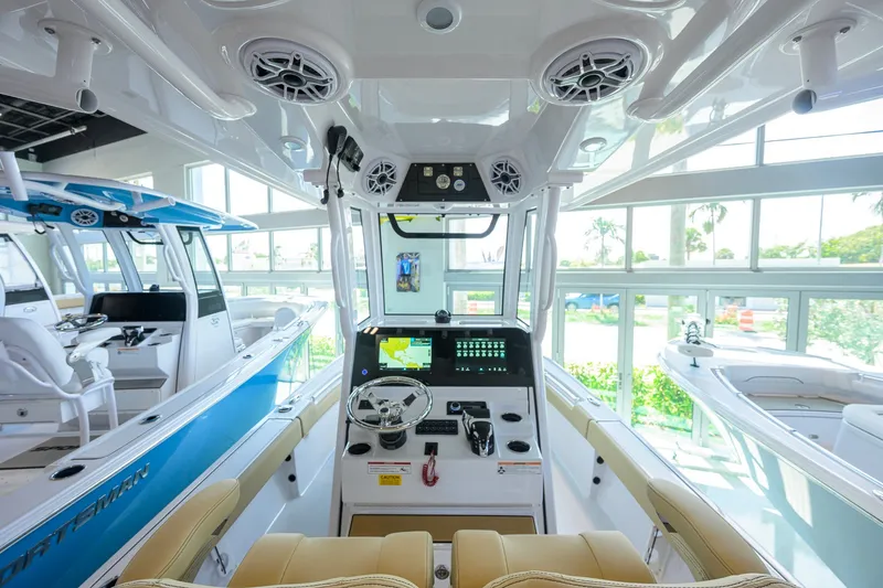 Slide: The Image of Interior view of 2026 Sportsman Masters 247OE Bay Boat, showcasing modern helm and seating. - 6