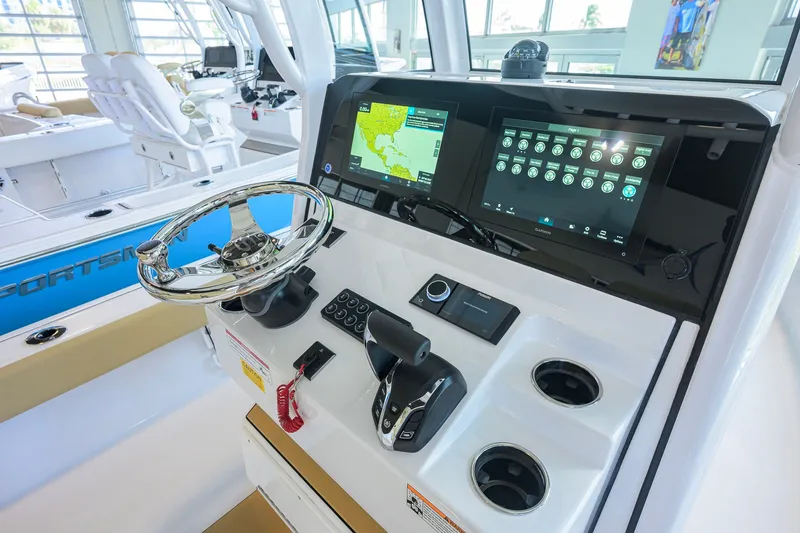 Slide: The Image of 2026 Sportsman Masters 247OE Bay Boat dashboard with advanced navigation and control systems. - 23