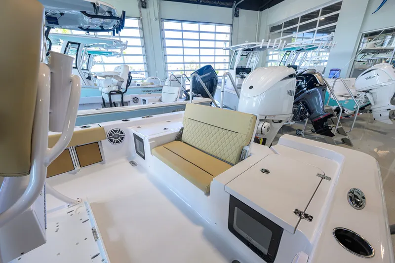 Slide: The Image of 2026 Sportsman Masters 247OE Bay Boat interior with seating and engine display. - 29