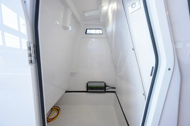 Slide: The Image of Interior cabin of 2026 Sportsman Masters 247OE Bay Boat, featuring sleek white design. - 42