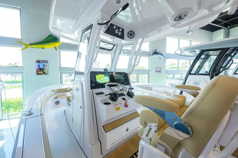 Slide: The Image of Interior view of 2026 Sportsman Masters 247OE Bay Boat with modern helm and seating. - 5