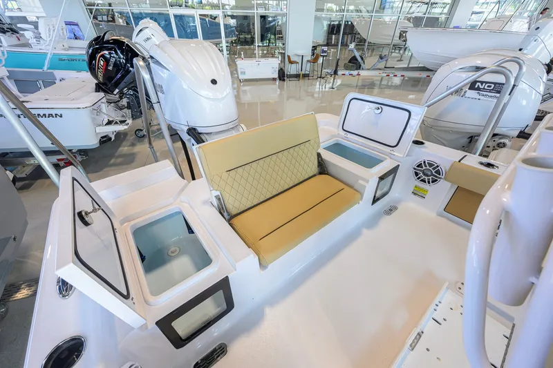 Slide: The Image of 2026 Sportsman Masters 247OE Bay Boat interior with seating and storage compartments. - 32