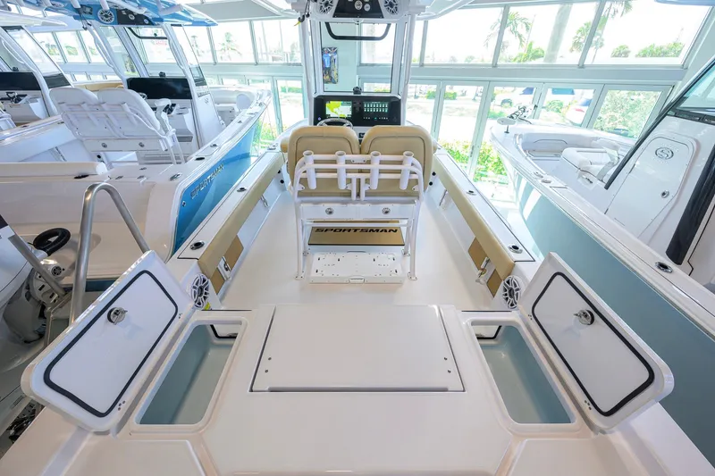 Slide: The Image of 2026 Sportsman Masters 247OE Bay Boat interior with seating and storage compartments. - 35