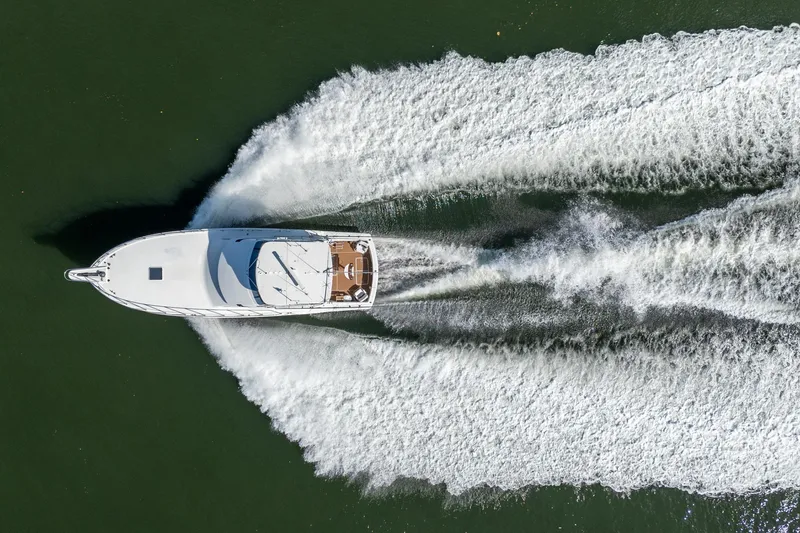 Slide: The Image of Aerial view of 1995 Hatteras 50 Convertible yacht cruising on water. - 40