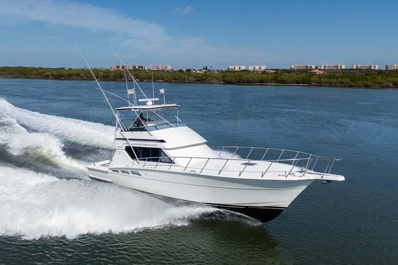 Slide: The Image of 1995 Hatteras 50 Convertible yacht cruising on a sunny day. - 7