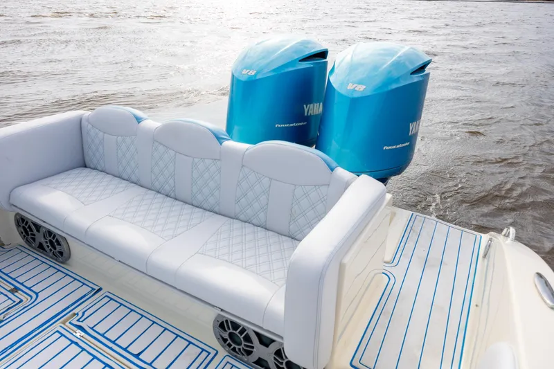 Slide: The Image of Luxury seating on 2014 Statement 350 Open boat with twin Yamaha V8 engines. - 13