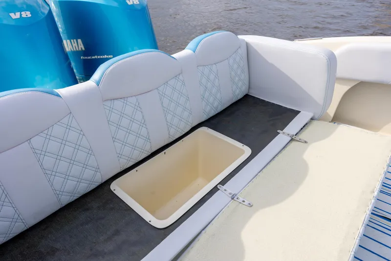 Slide: The Image of Interior of 2014 Statement 350 Open boat with Yamaha V8 engines, featuring storage compartment. - 15