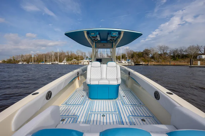 Slide: The Image of 2014 Statement 350 Open boat on water, featuring sleek design and spacious seating. - 16