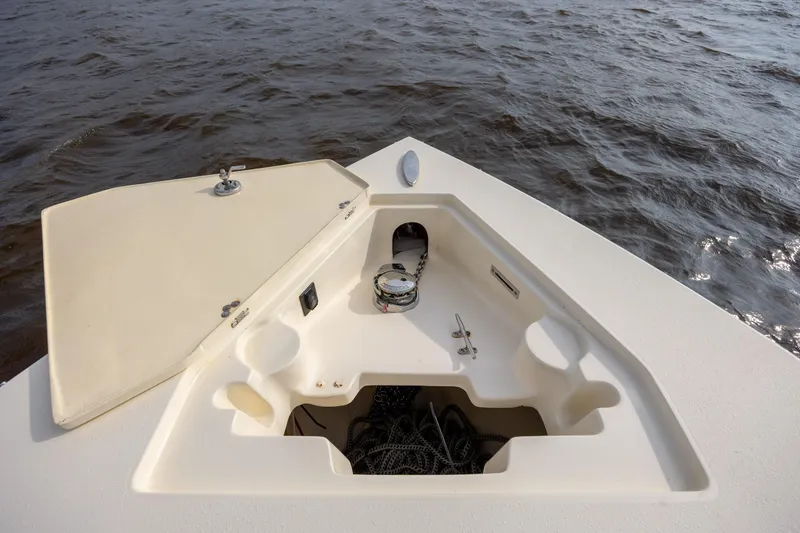 Slide: The Image of Bow of 2014 Statement 350 Open boat with anchor storage, on water. - 26