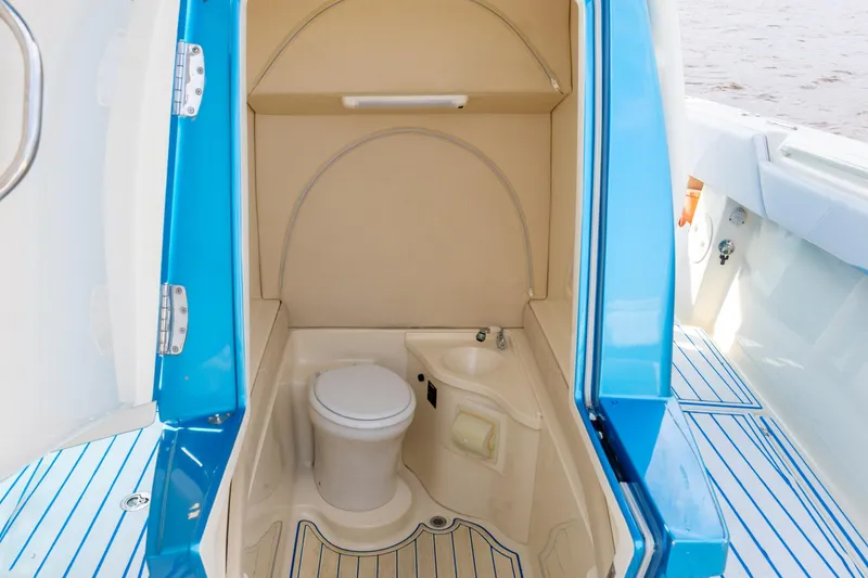 Slide: The Image of 2014 Statement 350 Open boat interior with compact bathroom and toilet. - 28