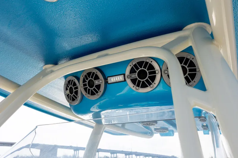 Slide: The Image of Speakers and lights on a 2014 Statement 350 Open boat's blue interior ceiling. - 30