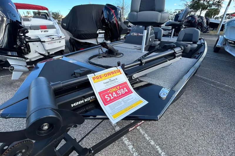 Slide: The Image of 2024 Tracker Bass Tracker Classic XL boat, pre-owned, priced at $14,984, displayed in a showroom. - 4