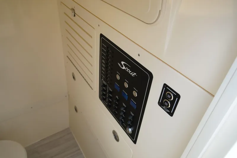 Slide: The Image of Control panel of 2026 Scout 288 LXF boat interior. - 32