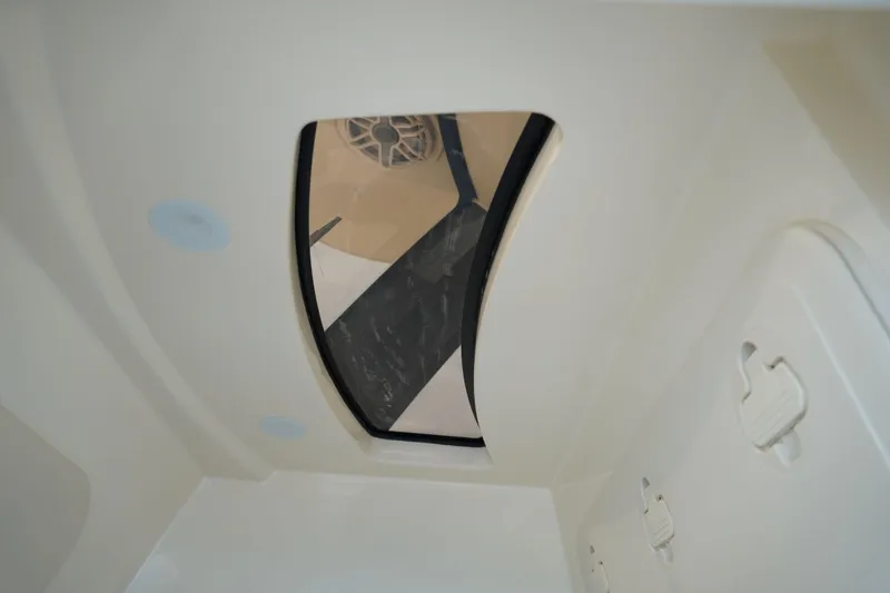 Slide: The Image of Interior view of 2026 Scout 288 LXF boat, featuring a sleek skylight design. - 34