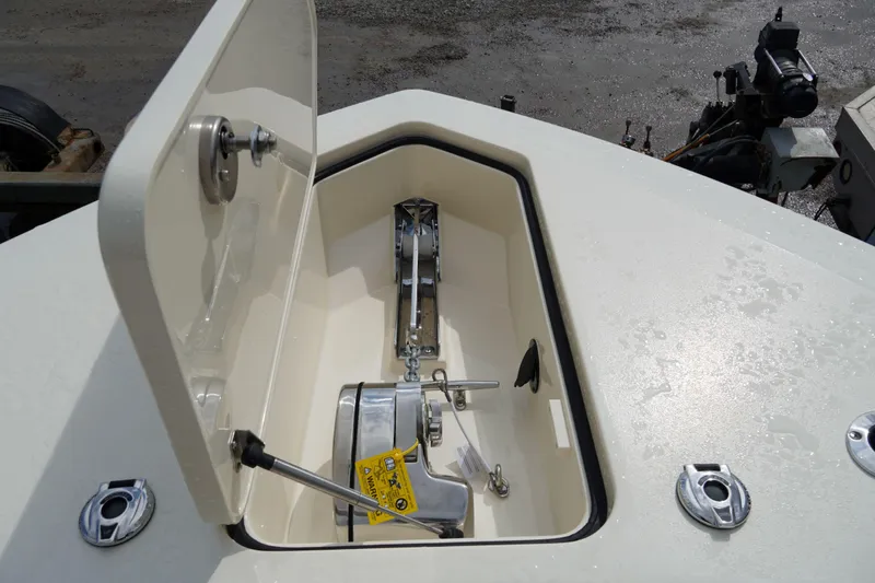 Slide: The Image of Anchor compartment of 2026 Scout 288 LXF boat, showcasing storage and mechanism. - 38