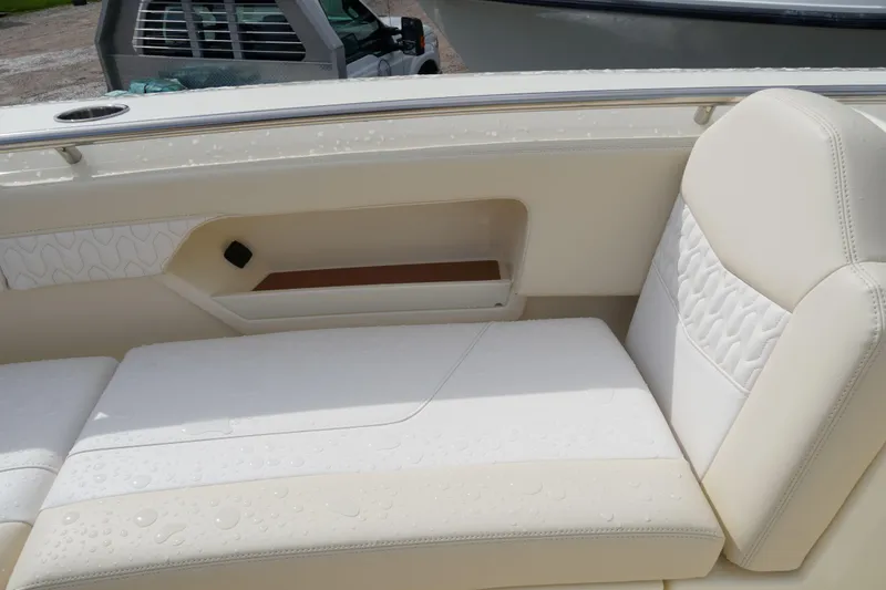 Slide: The Image of Luxurious seating on 2026 Scout 288 LXF boat, featuring elegant white upholstery. - 39