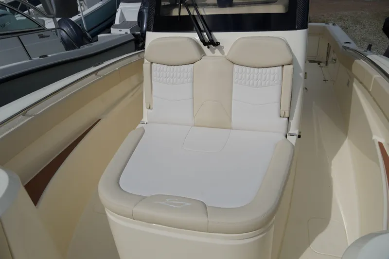 Slide: The Image of 2026 Scout 288 LXF boat interior with beige seating and modern design. - 41