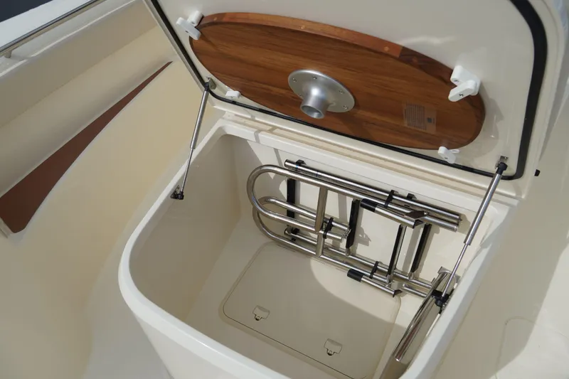 Slide: The Image of Storage compartment with ladder in 2026 Scout 288 LXF boat. - 42